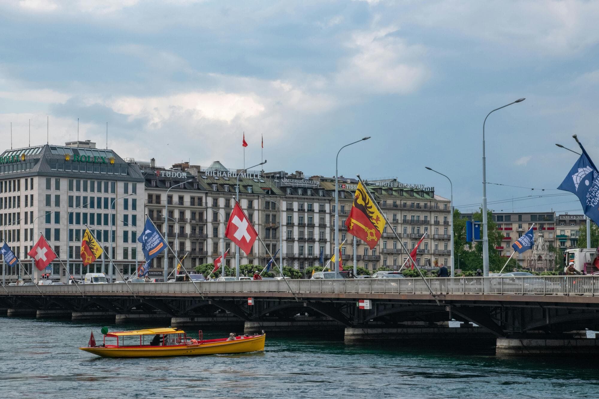 Panoramic photograph of Lake Geneva and the Alps at sunset